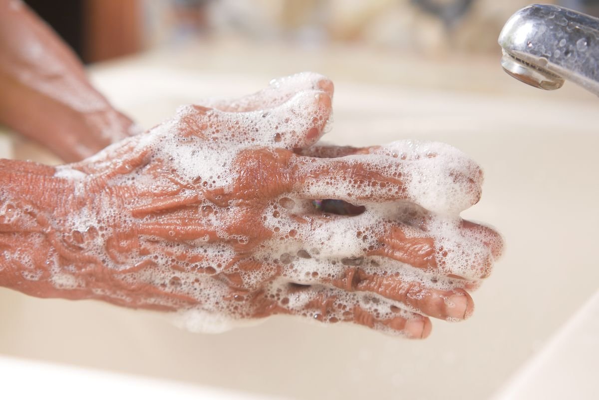 Hands lathered in soap — handwashing is the front line against impetigo spread
