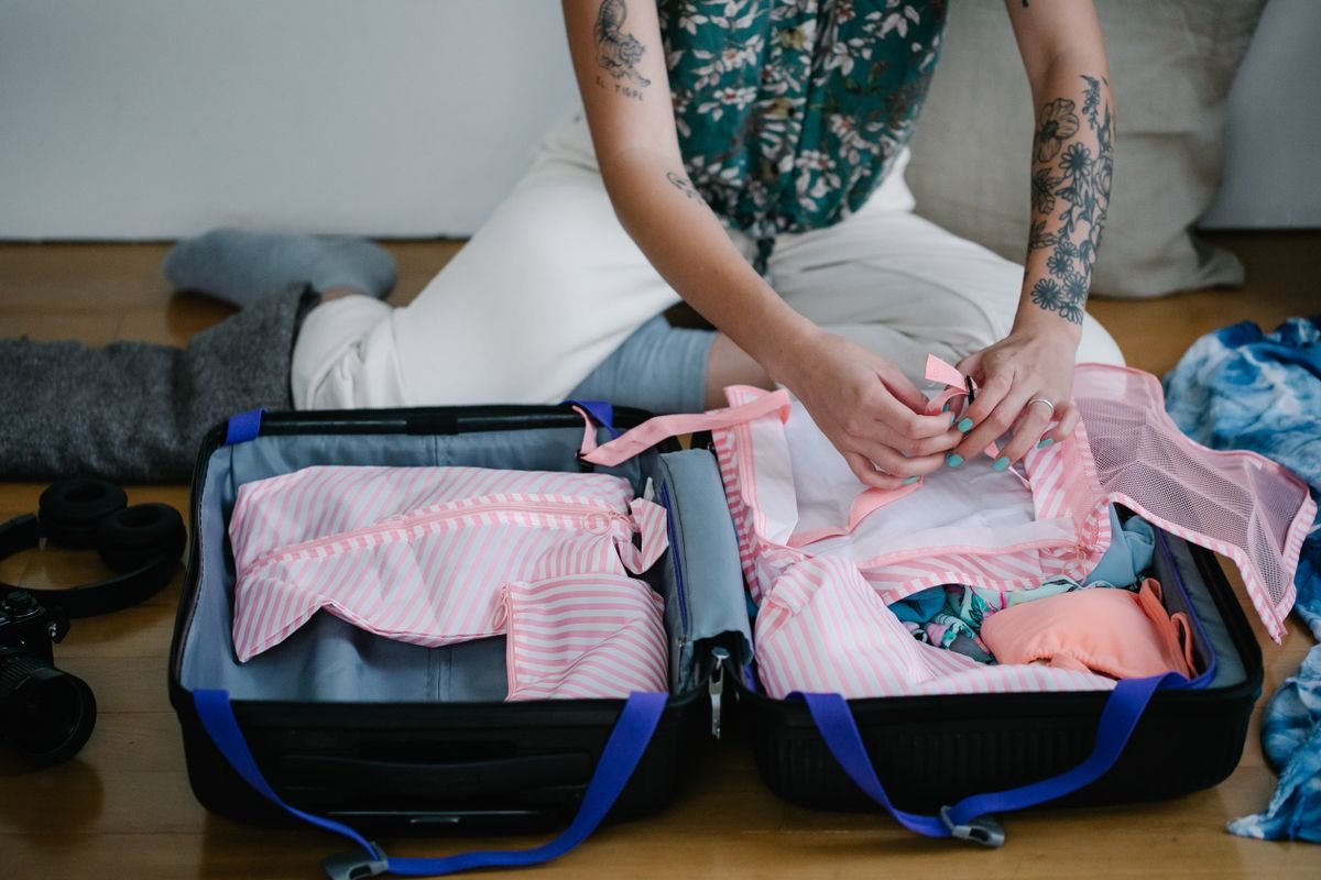Woman packing a suitcase for a trip