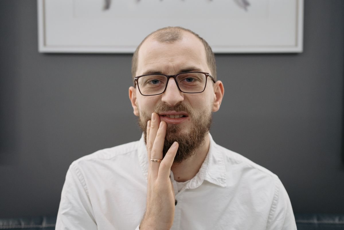 Man showing discomfort from jaw pain